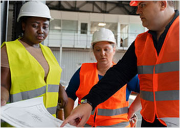 Construction professionals in Fort Collins discussing project details with financial and accounting guidance.
