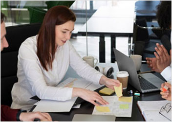 Service-based business owners in Northern Colorado reviewing documents with CPA and financial consulting support.